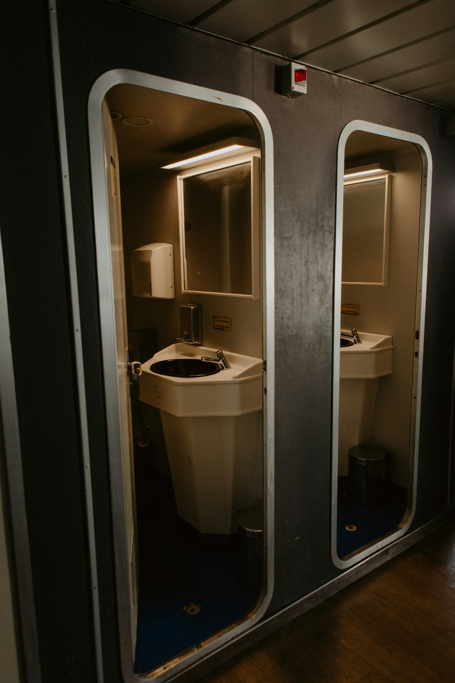 Warm bathroom vanity with mirrors, natural textures, and soft light